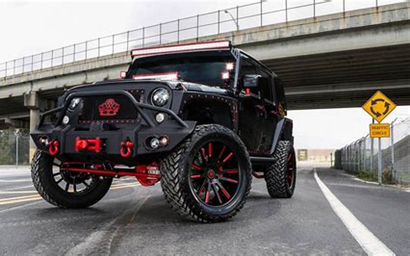 Black Jeep With Red Accents Off-Roading