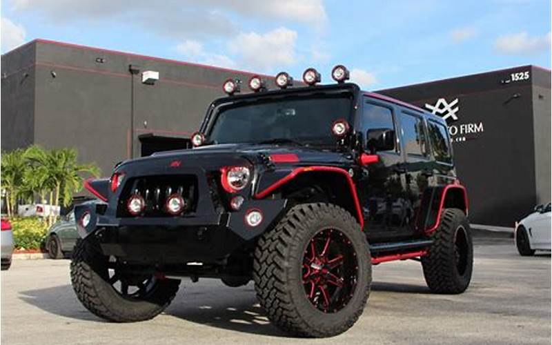 Black Jeep With Red Accents On The Road