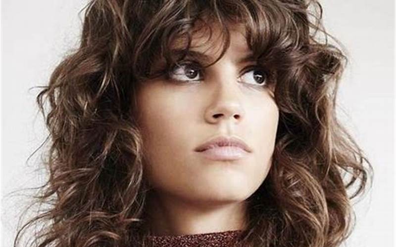 Bold Curly Bangs With Long Layers