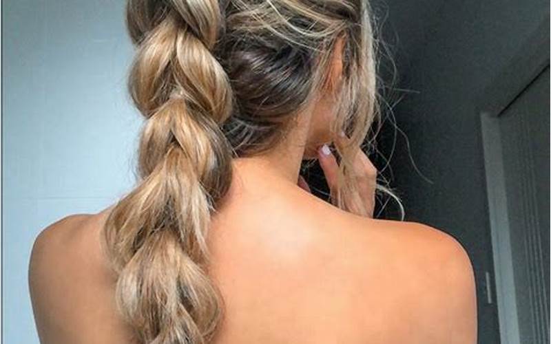 Braided Low Ponytail With Twisted Sections And Side Braid