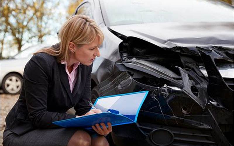 Driver Talking With Insurance Adjuster