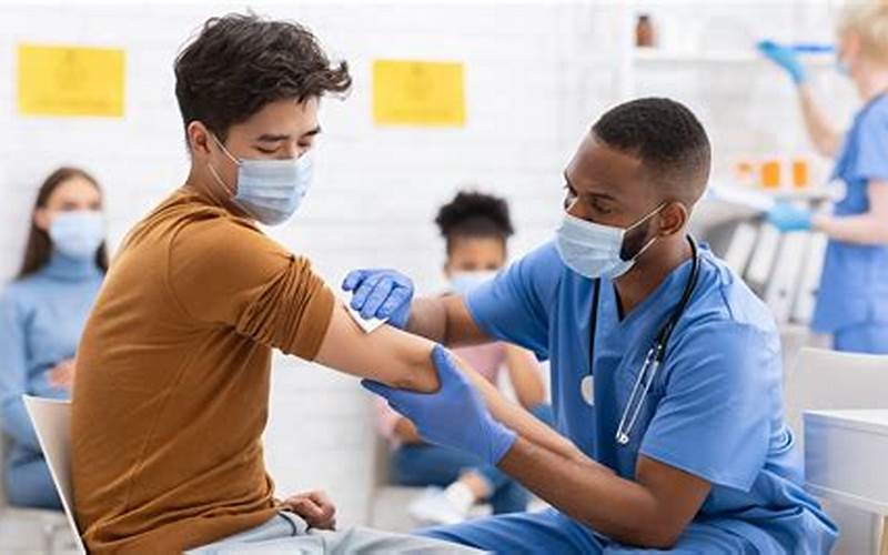 Image Of A Person Receiving A Vaccination At A Travel Clinic