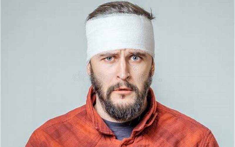 Man With Head Bandage