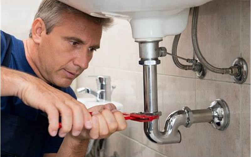 Plumber Fixing A Sink