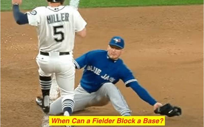 Softball Fielder Blocking The Base