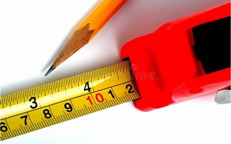 Tape Measure And Pencil