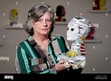 Eileen Fields holding her art piece, "Old Head on Young Shoulders ...