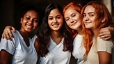 Premium Photo | Four girls in white tops smile for a photo