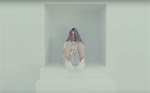 Billie Eilish attempts to escape the room in new video for 'hostage'