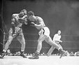 Rocky Marciano And Joe Louis Boxing by Bettmann