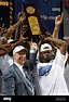 North Carolina head basketball coach Roy Williams (L) hoists the NCAA ...