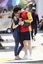 camila mendes and charles melton share a kiss as they leave the gym in ...