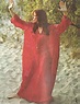 Carly Simon wearing red caftan standing on the sand. Photo from CIRCUS ...