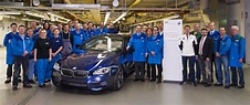 Josef Kerscher, plant director of BMW plant Dingolfing (next to car ...