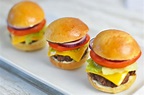Sliders - mini burgers with beef, cheese, tomato, red onion and lettuce
