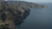 7.6K stock footage aerial video following the coast of Santa Catalina ...