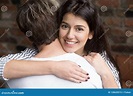 Portrait of Young Beautiful Wife Embracing Husband Stock Image - Image ...