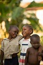 Happy African children embracing on street · Free Stock Photo