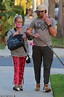 Kristin Chenoweth holds on to boyfriend Josh Bryant's arm as they walk ...