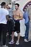 Mark Wahlberg reveals his chiseled abs and muscular biceps during a ...