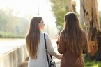 Back View of Two Women Walking and Talking in a Park Stock Image ...