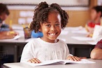 Portrait of African American elementary school girl in class - Stock ...