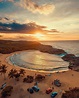 Pôr do sol na bela praia de Mar Chiquita uma das praias mais populares ...