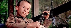 In Deliverance (1972), during the “dueling banjos” scene, Billy Redden ...
