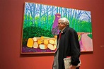 David Hockney walking in front of one of his paintings, shown at Museum ...