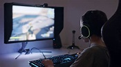 Child Gaming With Headset Seated At Computer Stock Footage SBV ...