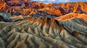 Eroded mountain ridges in the sunset at Zabriskie Point, Death Valley ...