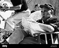 CLEOPATRA, cinematographer Leon Shamroy reading Daily Variety, on set ...