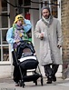 Jude Law enjoys a stroll with daughter Iris and his three-month-old ...