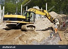 Bulldozer, Digger And Site Worker In Action, Road-Works Industry And ...
