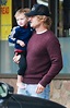 Owen Wilson carries his tired son Robert Ford in his arms as he ...