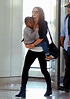 Sandra Bullock looks chic as she carries son Louis at New York's JFK ...