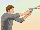 Cómo disparar un revólver: 15 pasos (con fotos)