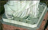 The Statute of Liberty Chains on her feet - LA Progressive