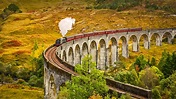 The Jacobite steam train crossing the Glenfinnan Viaduct in Inverness ...