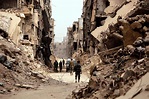 [Damascus, Syria] Syrian soldiers walk past destroyed buildings in ...