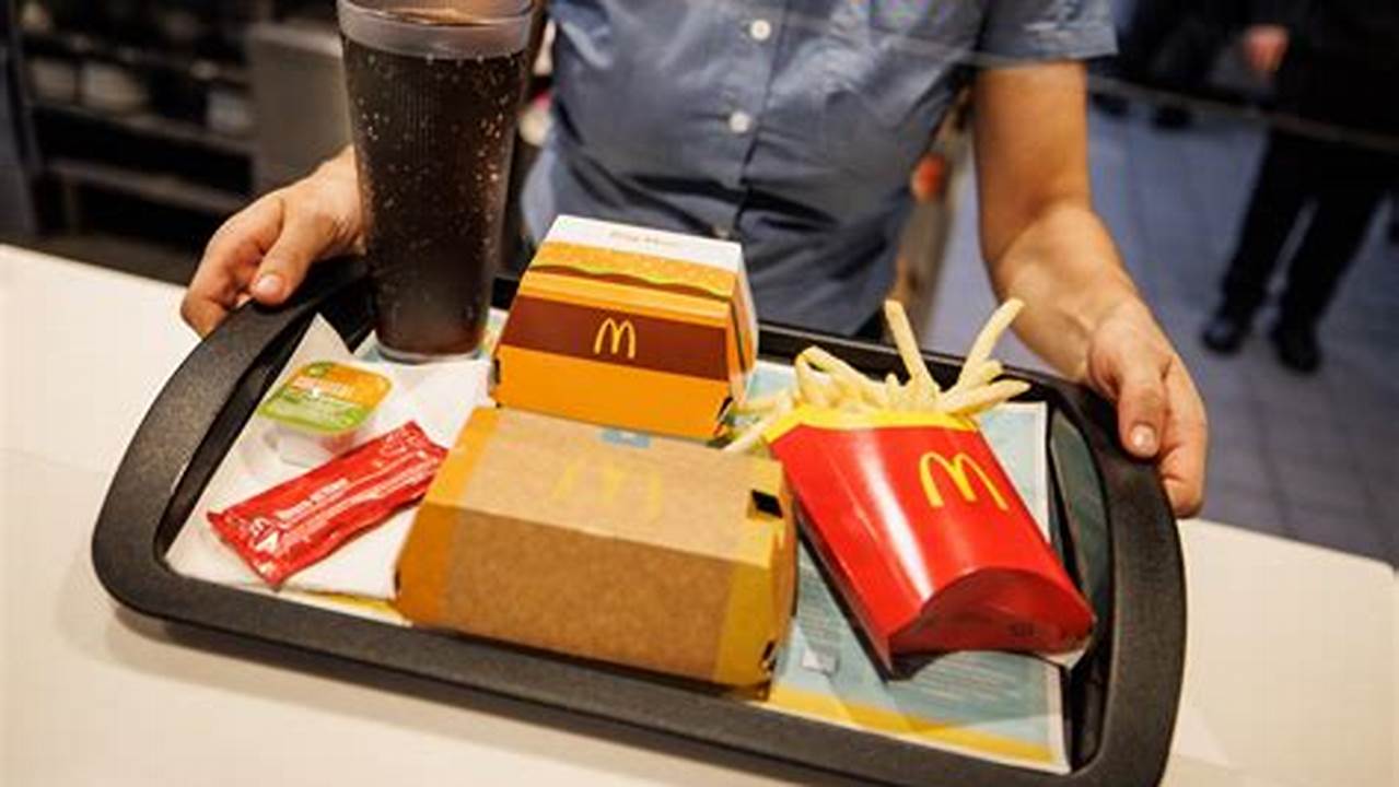 An Employee Hands Over A Tray At A Mcdonald&#039;s, Dec., 2024