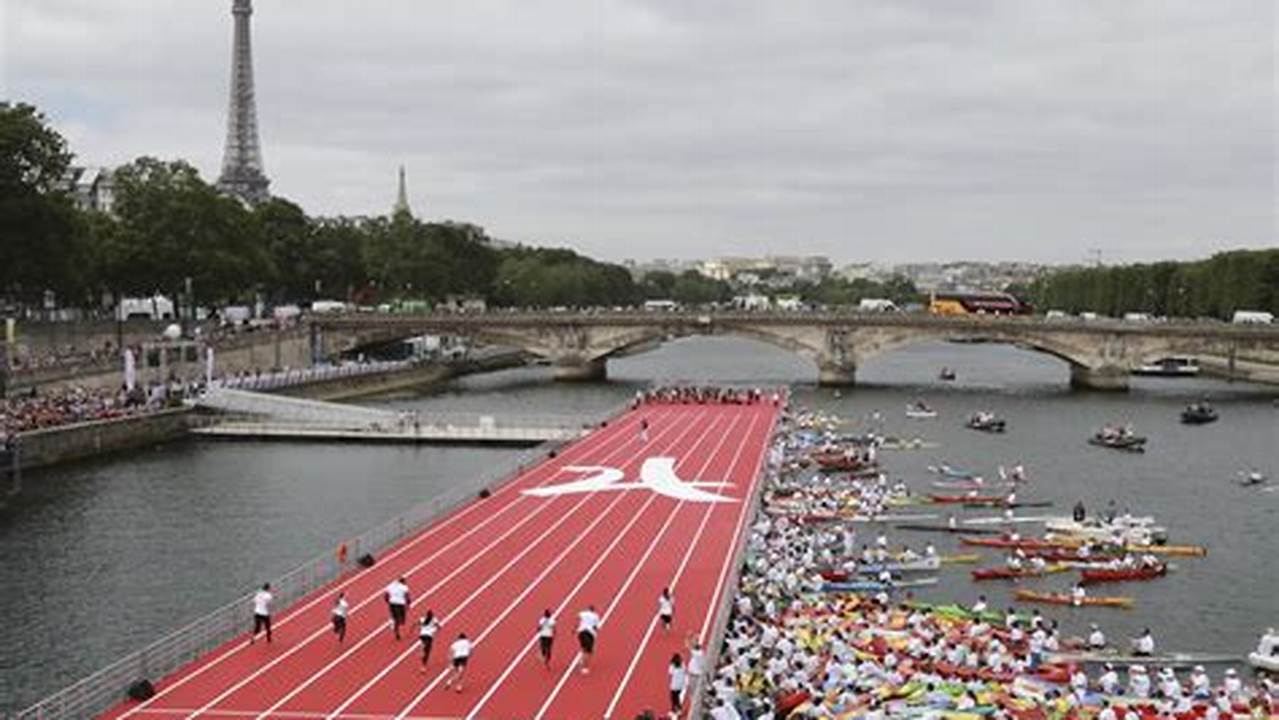 On One Screen, Olympic Athletes Are Travelling Along The Seine In A., 2024