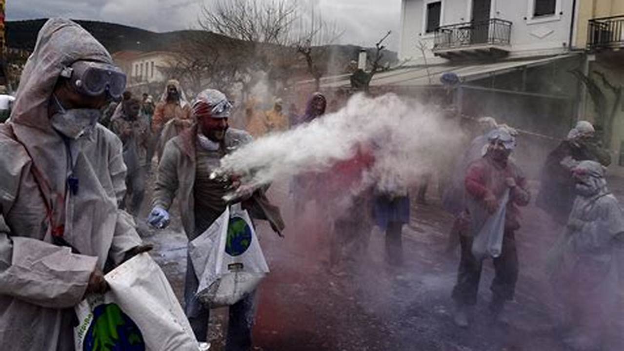 Revelers Participate In A Colorful Flour War, In The Town Of Galaxidi, Greece, March 18., 2024
