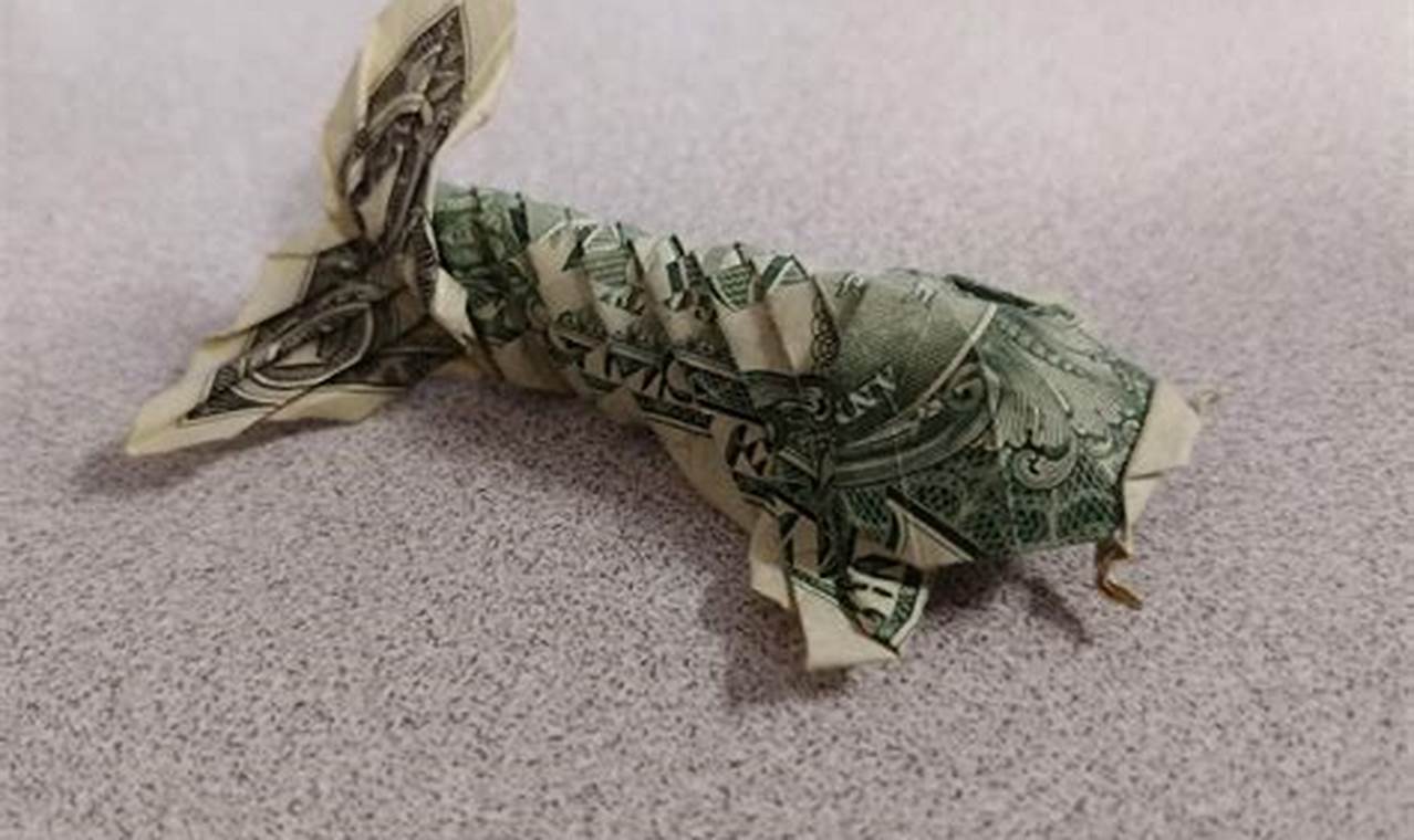 origami koi fish made out of a dollar bill