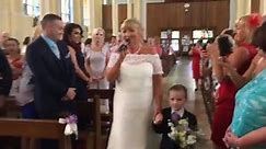 Bride sings down the aisle