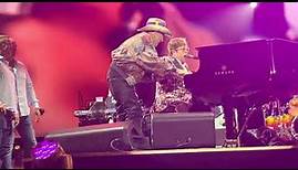 Molly Meldrum climbs onstage Elton John concert Melbourne 13 Jan 2023
