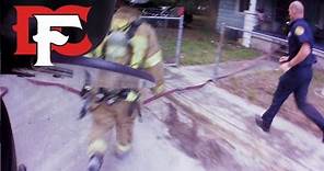 Firefighters Rescue Victim from Burning Home