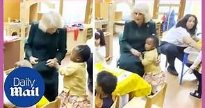 Cute moment Queen Consort Camilla gets a hug from a toddler at nursery
