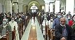 Worshippers wear face masks to attend Christmas Day mass in Bethlehem church