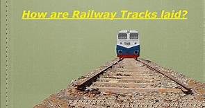 How are train tracks laid?